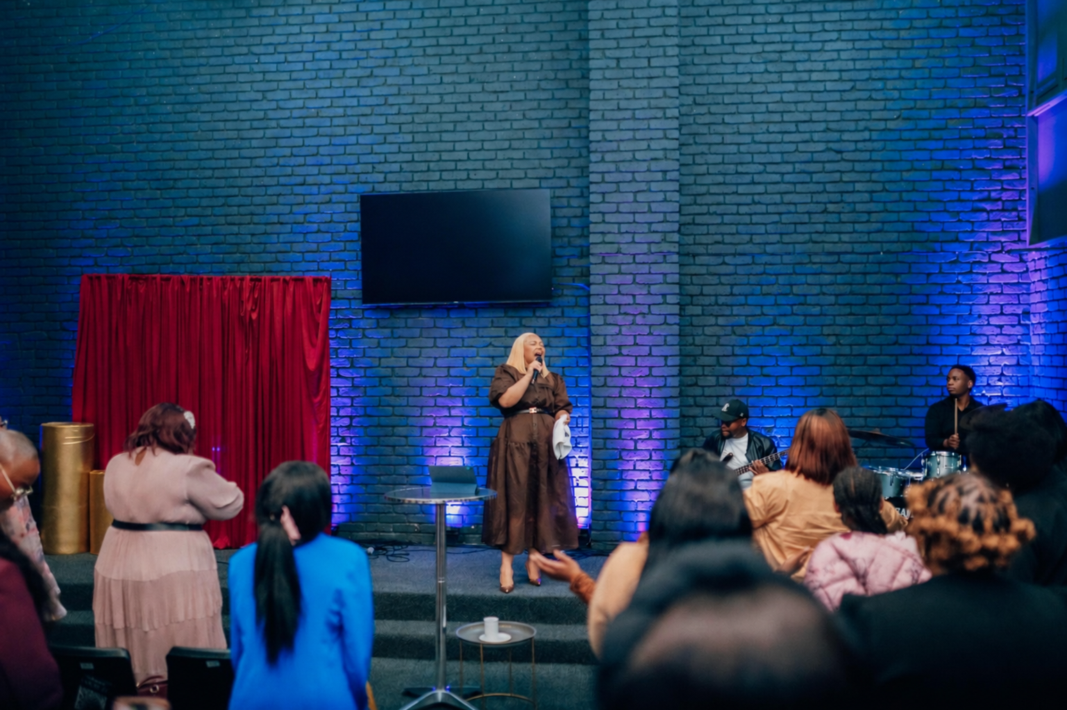 The Called Ones gathered in worship with Yolanda Bam-Mguye leading
