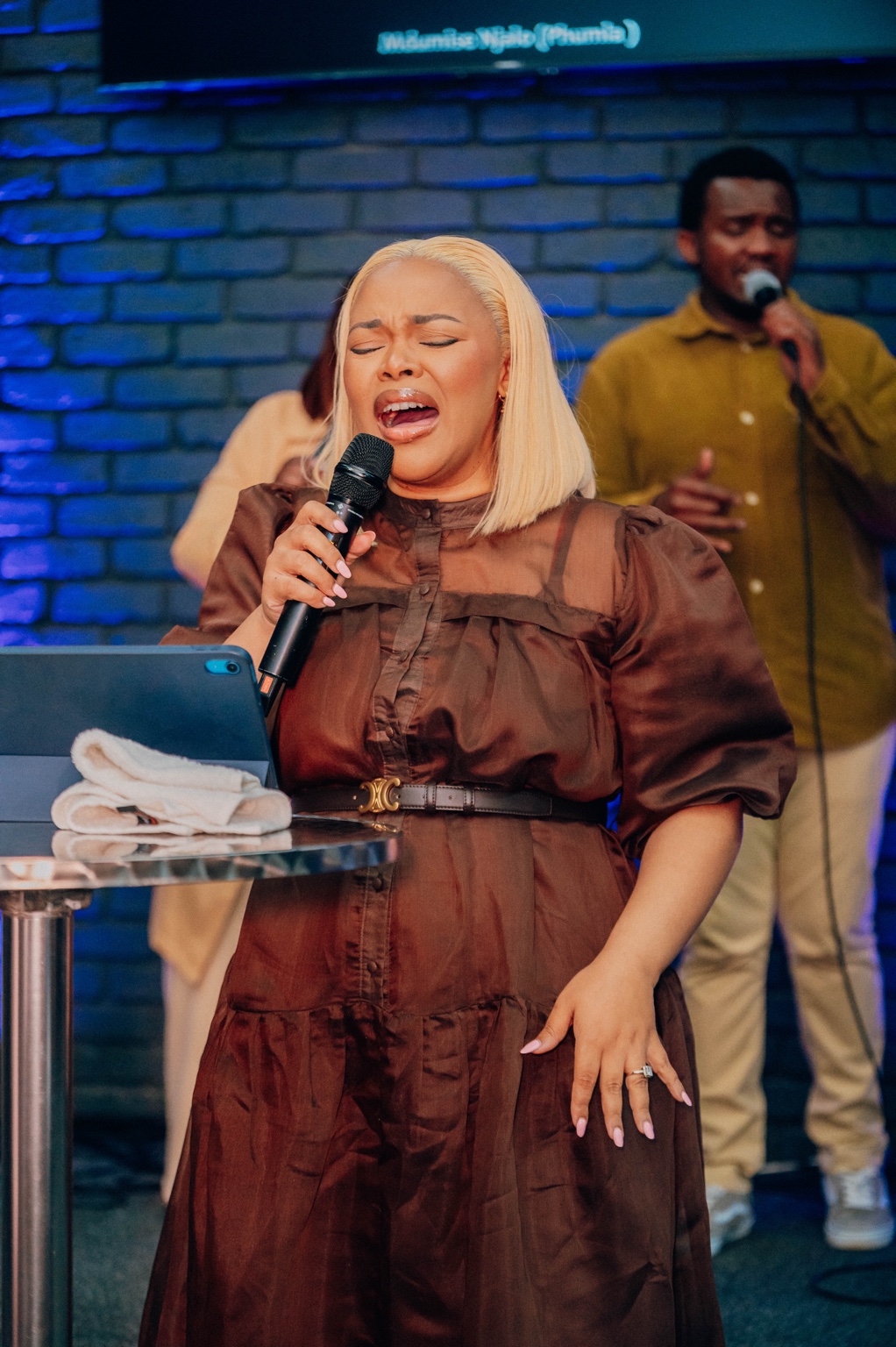 Yolanda Bam-Mguye leading in worship and prayer